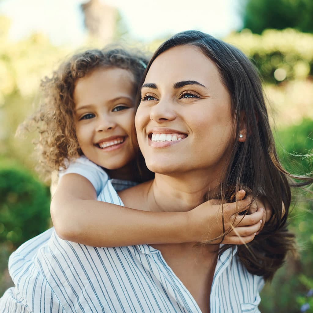 Mother and child smiling at Rundlehorn Smiles Dental